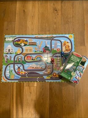 Melissa & Doug Blue Race Track Floor Puzzle with World Landmarks two racecars